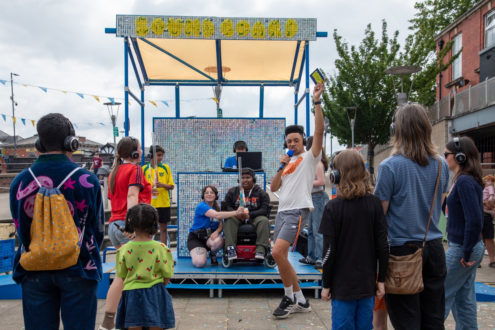 Group of people gathered around a stage