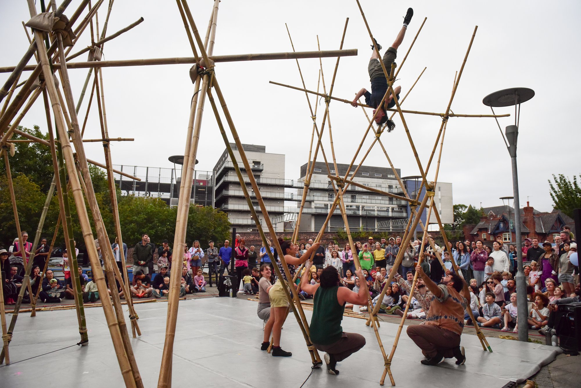 Acrobats on bamboo structure